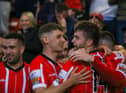 Derry City's Will Patching celebrates with his teammates after his winning goal against Sligo Rovers on Tuesday night.