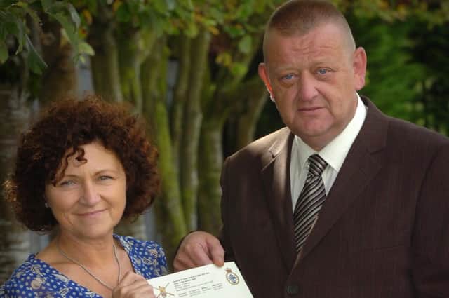 Billy McGreanery and Marjorie Roddy display the letter of apology from General Sir Peter Wall for the killing of Billy McGreanery on the 15th September 1971. (1309PG07)