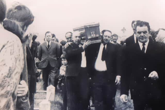 Dessie McGreanery, on right, carrying his younger brother and only siblings coffin in September 1971.