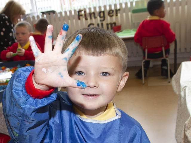 HAND PAINTER. . . . .Cooper Lynch enjoying painting.