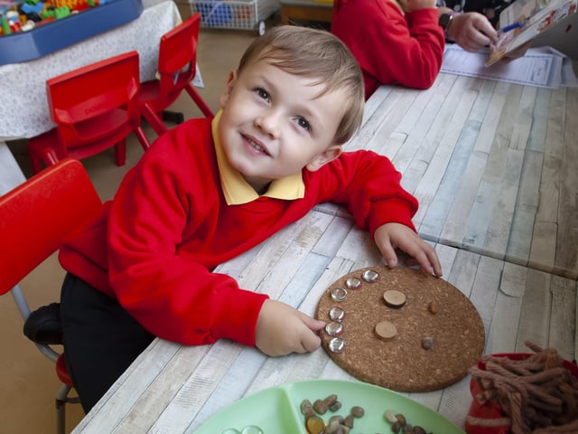 P1 pupil Cartern Power shows off his design in Mrs. Crampsey's class at Steelstown.