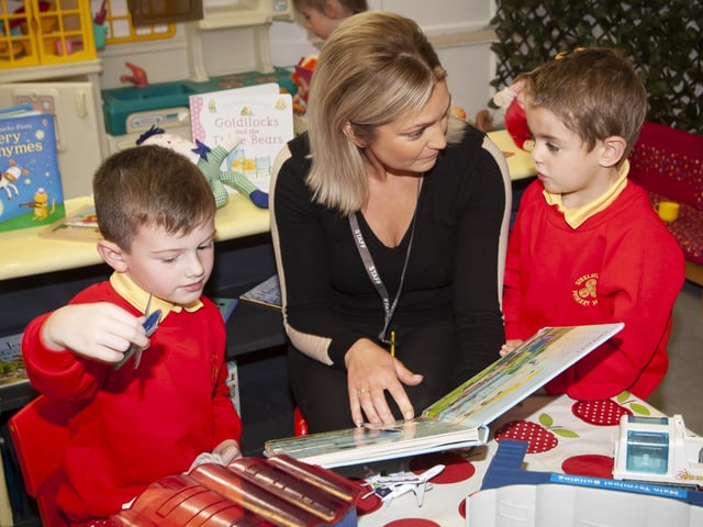Mrs Joanne McLaughlin, Classroom Assistant pictured with P1s from Mrs. O'Donnell's class Caleb Cassidy and Sean Lynn-Fox. (Photos: Jim McCafferty Photography)