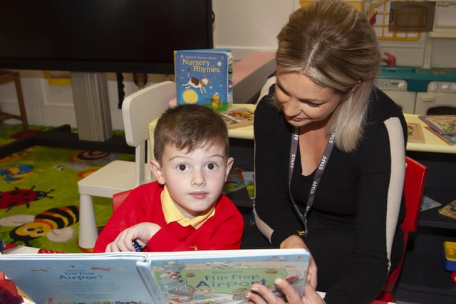 Kaleb Cassidy doing some reading with Mrs. Joanne McLaughlin, Classroom Assistant on Monday last at Steelstown PS. (Photos: Jim McCafferty Photography)