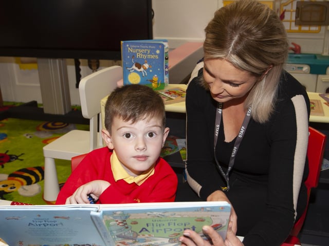 Kaleb Cassidy doing some reading with Mrs. Joanne McLaughlin, Classroom Assistant on Monday last at Steelstown PS. (Photos: Jim McCafferty Photography)