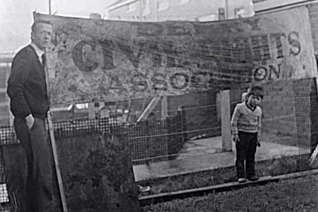 Johnny McKane with the iconic banner he recovered on Bloody Sunday.