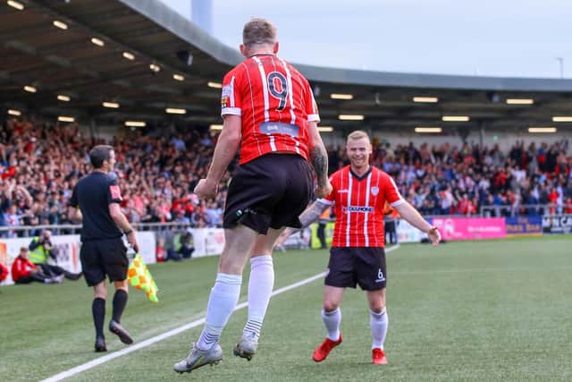 Derry City goalscorer Jamie McGonigle celebrates with Mark Connolly in front of the home support after his first half header against Shamrock Rovers. Photo by Kevin Moore.