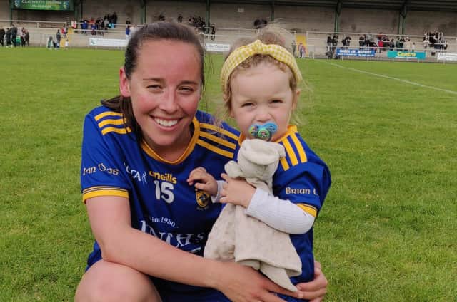 Steelstown Brian Ogs' Emma Doherty with her two year old daughter, Cara, after Sunday's superb Derry Senior Championship victory in Glen.