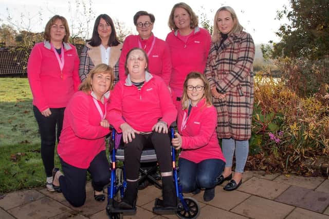 A very proud Jacqui (centre) with all her girls following their first ever Ladies Cycle for the Hospice. Pictured on the back row (L-R), Patricia McLaughlin, Michelle McLaughlin, Miriam Mullion, Grainne Kelly and Elly McLaughlin. At the front, the late Jacqui Campbell, centre, with friends, Bridgeen Gillespie and Brenda Crossan.