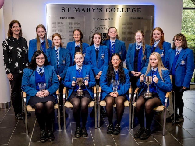 Miss Mairead Treacy congratulating Year 13 Attendance Prize-winners