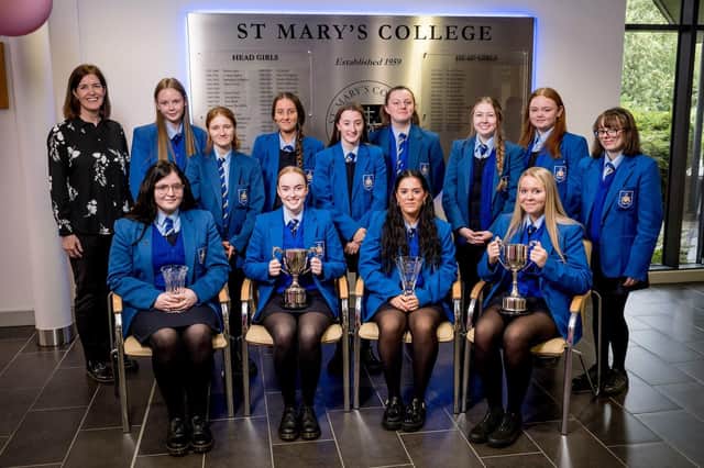 Miss Mairead Treacy congratulating Year 13 Attendance Prize-winners