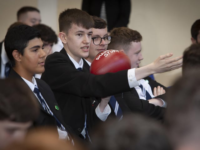 Karl Baldwin, Year 13 student pictured with Rugby Ball, asking a question at the recent Tell Your Story Roadshow event held by the BBC in St Columb's College. (Photos: Jim McCafferty Photography)