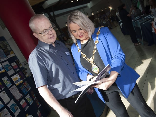 The Mayor, Sandra Duffy getting some information from Paschal Keys at the Derry Strabane Jobs Fair.