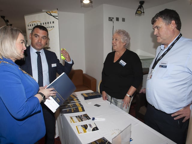 Mayor Sandra Duffy chatting to Joe Lavery, DFC and Barbara Gibson and Declan Martin, Cross Border Partnership Employment Services, exhibitors at the Derry Strabane Jobs Fair on Thursday at the Millennium Forum.