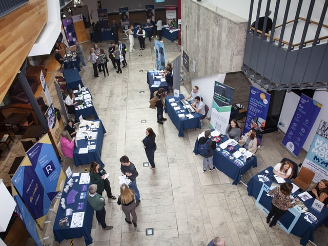 Stall holders preparing for the opening of Thursday's Derry and Strabane Jobs Fair at the Millennium Forum, Derry.