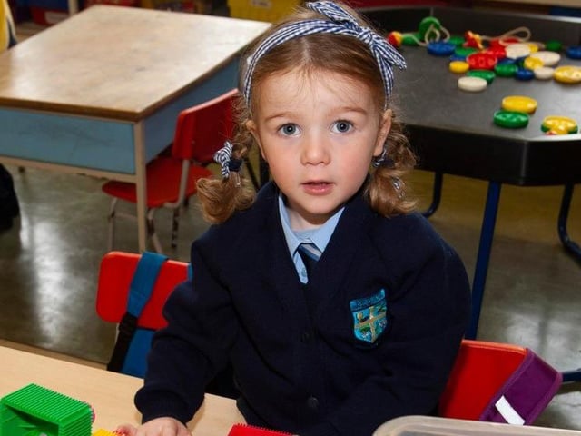 Mrs. Harkin’s P1 pupil Rachel Bradley poses for a photo.