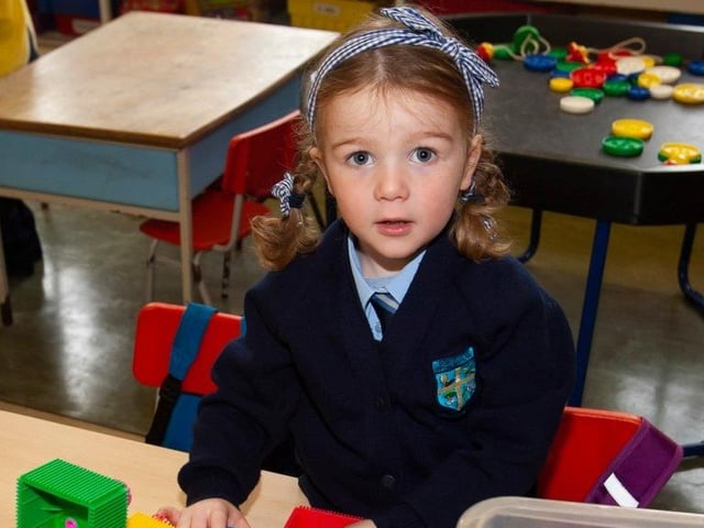 Mrs. Harkin’s P1 pupil Rachel Bradley poses for a photo.