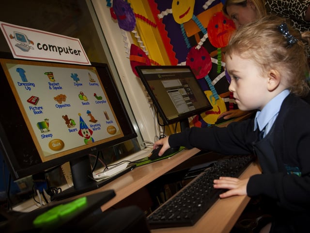 A dab hand on the computer is Connie Young, a P1 pupil in Mrs. Harkin's class.