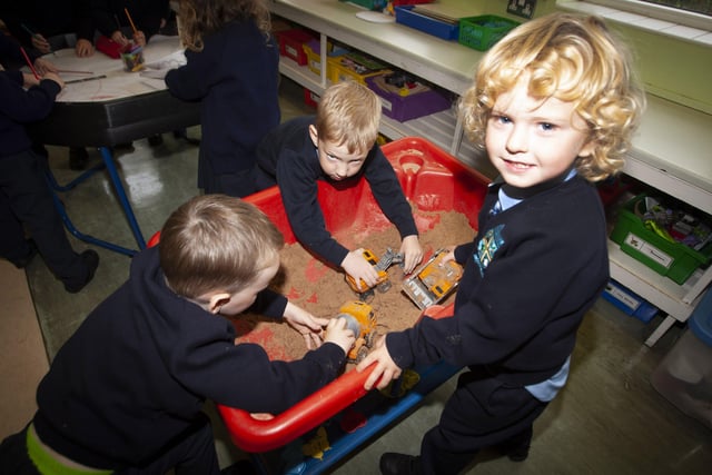Primary 1 pupils Noel O'Donnell, Barra McCarron and Odhran McDaid enjoying playtime.