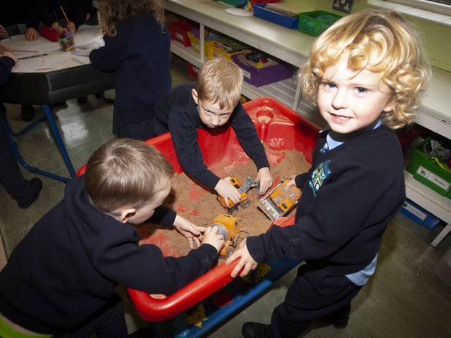 Primary 1 pupils Noel O'Donnell, Barra McCarron and Odhran McDaid enjoying playtime.