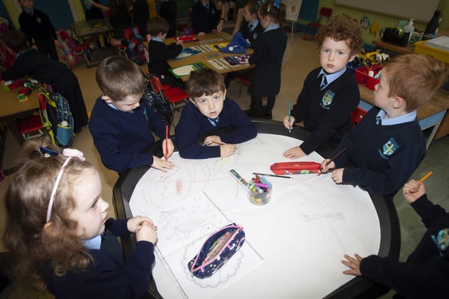 Some of the children in Mrs. White's P1 class enjoying drawing on Tuesday morning last.