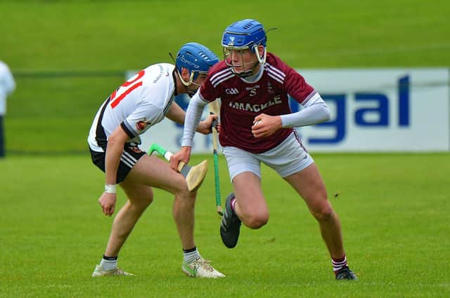 Slaughtneil’s Ruairi O’Mianáin weaves past Ronan Mullan of Kevin Lynch’s during the Derry SHC Final at Owenbeg on Sunday afternoon last. Photo: George Sweeney. DER2239GS – 023