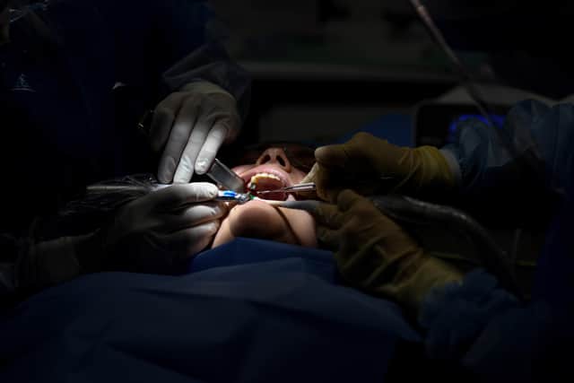 Dentists. (Photo by OSCAR DEL POZO / AFP) (Photo by OSCAR DEL POZO/AFP via Getty Images)