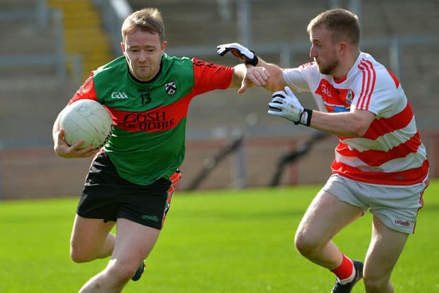 Doire Trasna’s Colin Murray holds of a challenge from Ballerin's Sean Ferris during the JFC Semi Final in Celtic Park on Sunday afternoon last. Photo: George Sweeney.  DER2240GS – 010