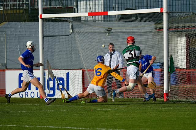 Na Magha's Michael Lynch scores the first of his three goals against Warrenpoint in the Ulster Hurling Junior Club Championship Q/F in Celtic Park on Sunday afternoon. (Photo: George Sweeney)