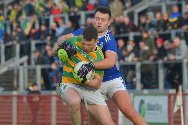 Galbally's Conor Donaghy grapples with Glenullin's Dermot O'Kane. (Photo: George Sweeney)