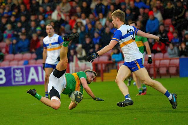 Glen's Ryan Doughan gets to the ball ahead of Errigal Ciaran's Padraig McGirr during the Ulster SCC quarter-final in Celtic Park. (Photo: George Sweeney)