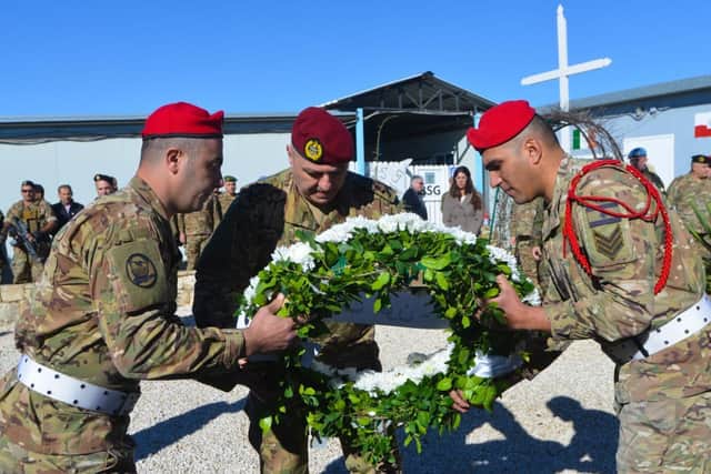 General Joseph Aoun, lays a wreath in honour of Private Seán Rooney, during a visit to Camp Shamrock.