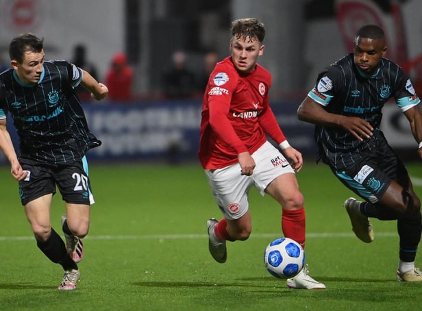 Larne's Ben Doherty skips away from Linfield duo Stephen Fallon and Christy Manzinga, during last season's encounter at Inver Park. Picture by Stephen Hamilton/INPHO