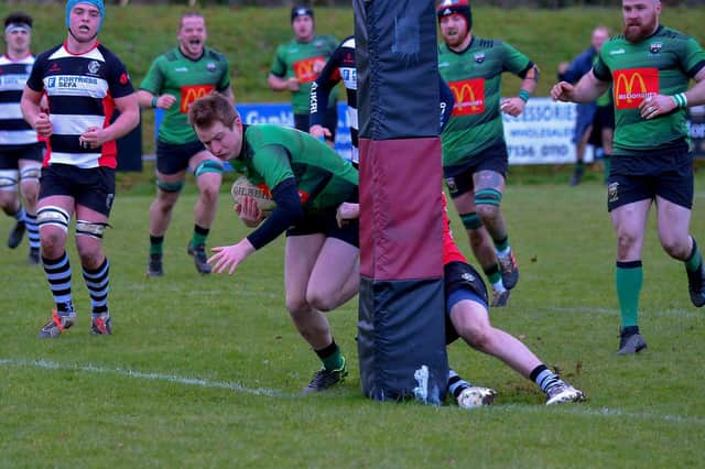 City of Derry ‘s David Lapsley scores a first half try against Cooke at Judges Road. (Photo: George Sweeney).