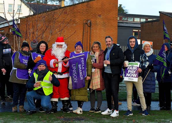 Health and care workers from NIPSA, UNISON and GMB trade unions, campaigning for fair pay and conditions, take part in industrial action at Altnagelvin Hospital on Monday morning. Photo: George Sweeney. DER2250GS – 03
