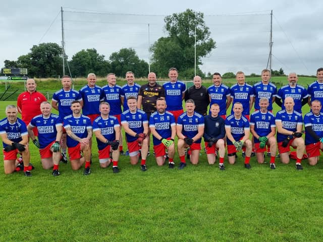 The Derry Masters squad, sporting Bellaghy jerseys, line out before their weekend game against Louth.