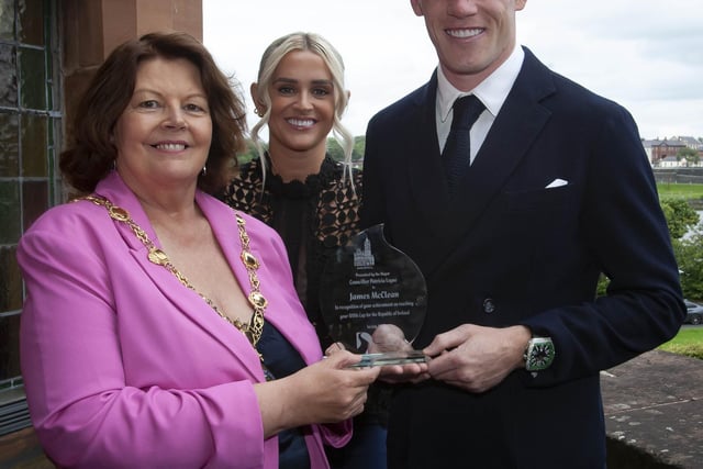 Wigan and Republic of Ireland footballer James McClean with wife Erin and Mayor of Derry City and Strabane District Council, Councillor Patricia Logue at the civic reception in the Guildhall in recognition of his 100th cap for the Republic of Ireland.