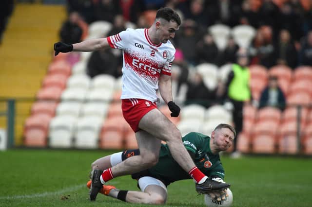 Armagh keeper Blaine Hughes makes a crucial first half save against Derry's Diarmuid Baker in the Athletic Grounds on Saturday. (Photo: John Merry)