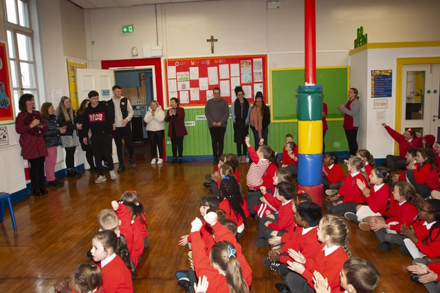 Derry City duo Declan Glass and Cameron McJannet receive a rapturous reception on their arrival at St. Eugene’s PS on Tuesday afternoon.