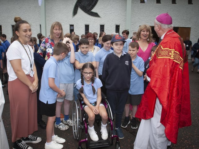 Bishop McKeown pictured with some of the children and teachers from Ardnashee after the Mass of Thanksgiving.