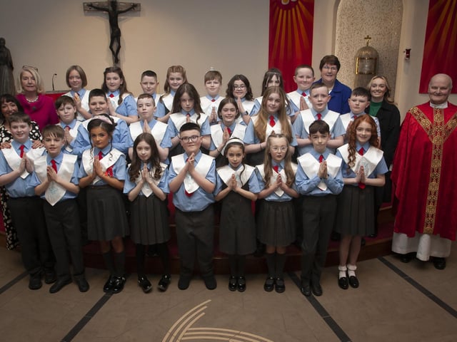 Pupils from Mrs. Jennifer Gallagher’s class at St. Brigid’s Primary School who received the Sacrament of Confirmation from Fr. John Farren at St. Brigid’s Church, Carnhill on Wednesday afternoon last. Included is Principal Ms. Mary McCallion and Classroom Assistants Mrs. Iona Wiley and Miss Tia Finnis. (Photo: Jim McCafferty Photography)