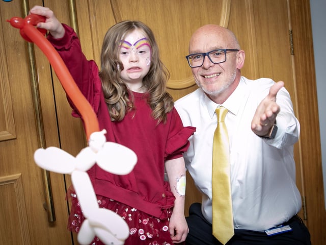 Little Zara Hamill showing off her magic tricks to the Mayor's driver  Mal Duddy at Friday night's FDST celebrations. (Photos: Jim McCafferty Photography)