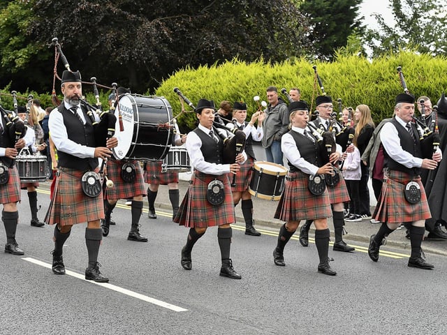 Muff Feile opening parade makes its way through the village on Friday evening. Photo: George Sweeney