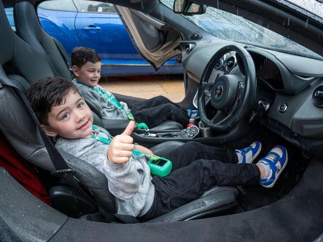 Twins Aodhàn and Connor McCaul (5). Derry City and Strabane District Council Mayor, Councillor Lilian Seenoi-Barr has hosted Supercar Saturday in Guildhall Square to raise money for the Mayoral Charity Bud Club. The event attracted car enthusiasts and owners from across the region to support aid the local charity. Picture Martin McKeown. 24.05.25