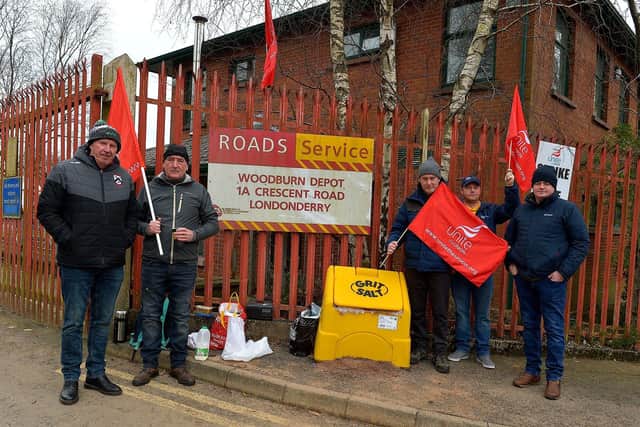 Striking Roads Services workers picket the Depart for Infrastructure Woodburn Roads depot on Crescent Road on Wednesday morning. Photo: George Sweeney. DER2310GS – 16