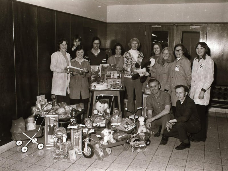 BSC workers in Springtown handing over toys, gifts and a cheque for Stradreagh & Foyle Special Care.