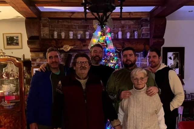 TIGHT KNIT . .  Ruaidhri Higgins pictured with his family including his mother and father, his brothers Michael, Paddy and the late Kevin.