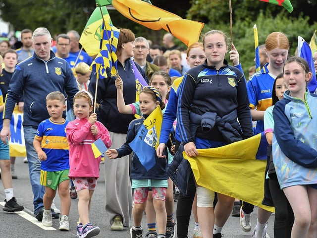 Muff Feile opening parade makes its way through the village on Friday evening. Photo: George Sweeney