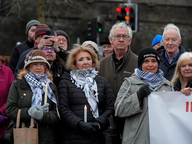 People carry candles at a Holocaust Memorial Day vigil for Gaza, in the Peace Garden, on Saturday afternoon. Photo: George Sweeney