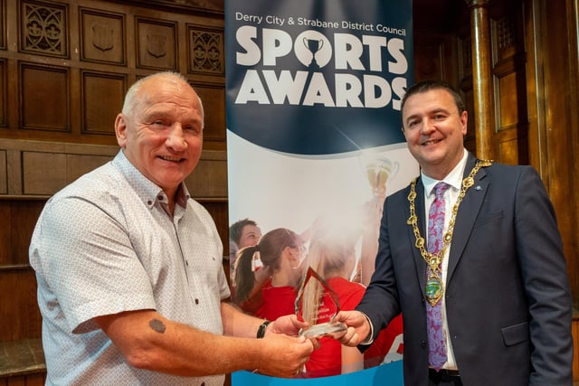 The Mayor Councillor, Ruairí McHugh, presents Olympic boxing referee Ben McGarrigle from Mourne Golden Gloves, Strabane, with a Special Recognition Award,  as he hosted the annual Derry City and Strabane District Council Sports Awards in the Guildhall. Picture Martin McKeown. 05.06.25