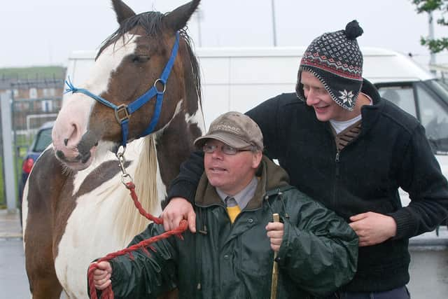 June 2012: Mark Wylie and Danny McCarron hold on tight during the historic Horse Fair in Derry. Picture Martin McKeown. Inpresspics.com. 16.6.12